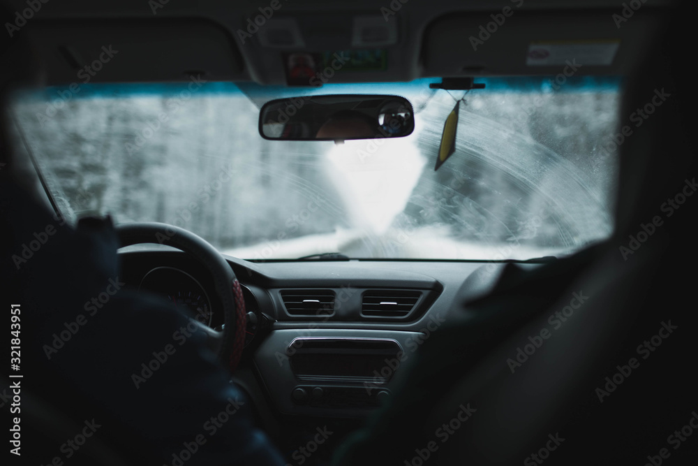 winter trip by car through a snowy forest. winter trip by car through a snowy forest.