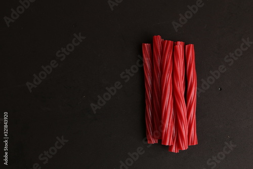 sweet red gummy licorice in color background