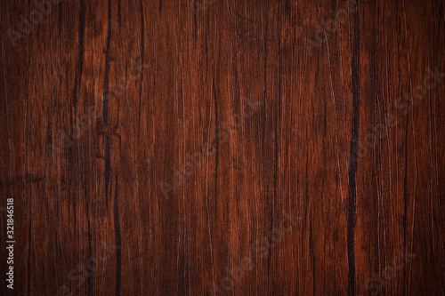 Seamless dark brown wooden board texture background with vignette