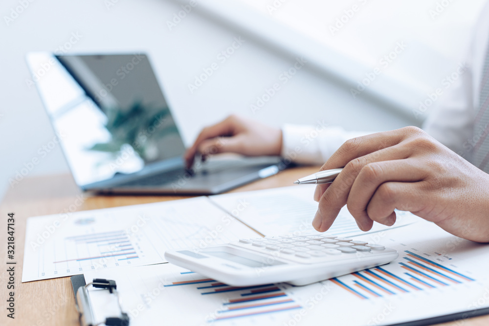 Businessmen use graphs to summarize results and calculate income-expenses to find financial balance points and use them to improve and advance business, finance and economic concepts. Businessmen use graphs to summarize results and calculate income-expenses to find financial balance points and use them to improve and advance business, finance and economic concepts.