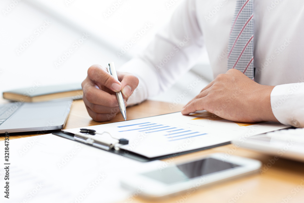 Businessmen use graphs to summarize results and calculate income-expenses to find financial balance points and use them to improve and advance business, finance and economic concepts.