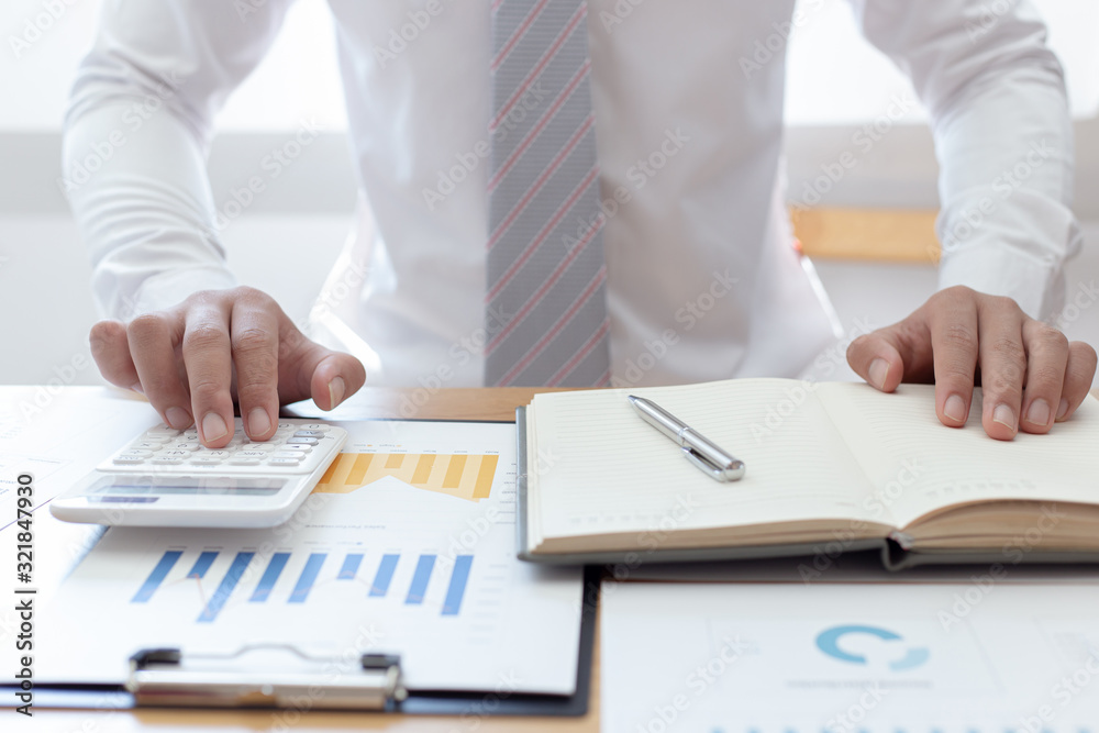 Businessmen use graphs to summarize results and calculate income-expenses to find financial balance points and use them to improve and advance business, finance and economic concepts. Businessmen use graphs to summarize results and calculate income-expenses to find financial balance points and use them to improve and advance business, finance and economic concepts.