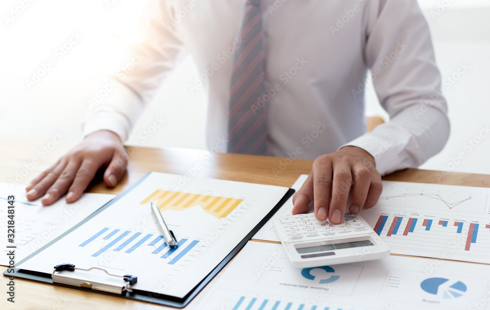 Businessmen use graphs to summarize results and calculate income-expenses to find financial balance points and use them to improve and advance business, finance and economic concepts. Businessmen use graphs to summarize results and calculate income-expenses to find financial balance points and use them to improve and advance business, finance and economic concepts.