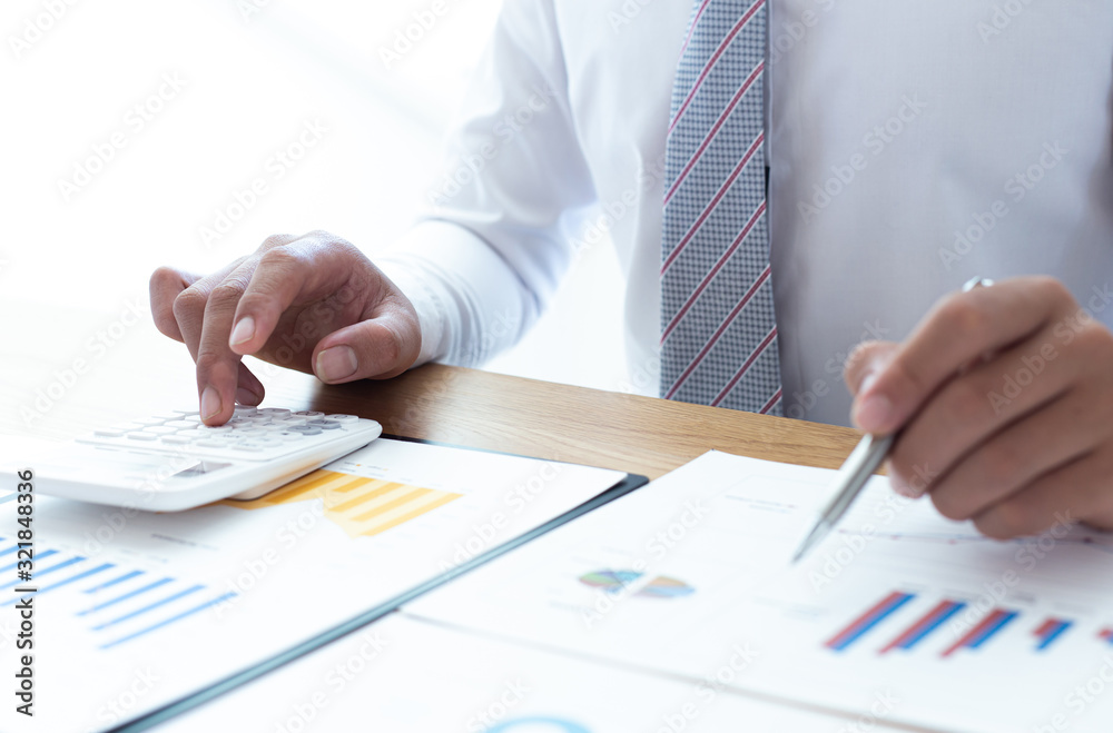 Businessmen use graphs to summarize results and calculate income-expenses to find financial balance points and use them to improve and advance business, finance and economic concepts. Businessmen use graphs to summarize results and calculate income-expenses to find financial balance points and use them to improve and advance business, finance and economic concepts.
