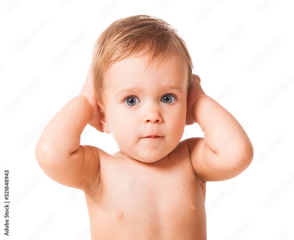 Close up of cute happy child placing hands on ears. Joyful infant kid looking aside and smiling. Isolated on white studio background. Concept of childhood. Close up of cute happy child placing hands on ears. Joyful infant kid looking aside and smiling. Isolated on white studio background. Concept of childhood.
