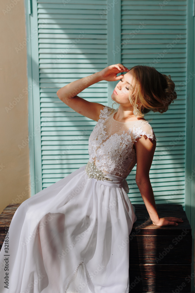 portrait of a beautiful girl with blue eyes and white hair with a bouquet of flowers and a white dress portrait of a beautiful girl with blue eyes and white hair with a bouquet of flowers and a white dress