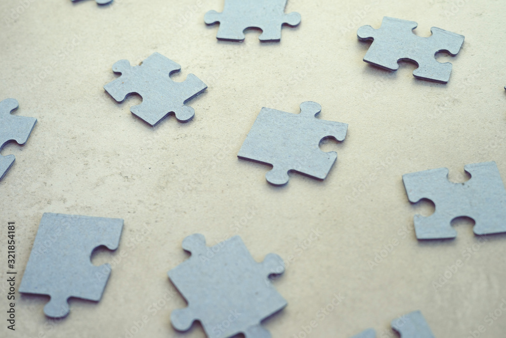 Fototapeta premium puzzle pieces on concrete dackground, selective focus