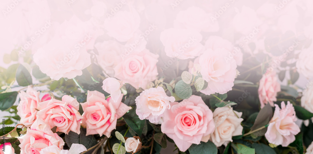 Beautiful rose flowers on a light background. Floral frame in soft colors with white space for text. Art flower background for greeting card for Mother's Day and Valentine's day Beautiful rose flowers on a light background. Floral frame in soft colors with white space for text. Art flower background for greeting card for Mother's Day and Valentine's day