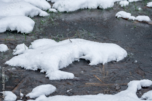 little pond covered with snow in winter.