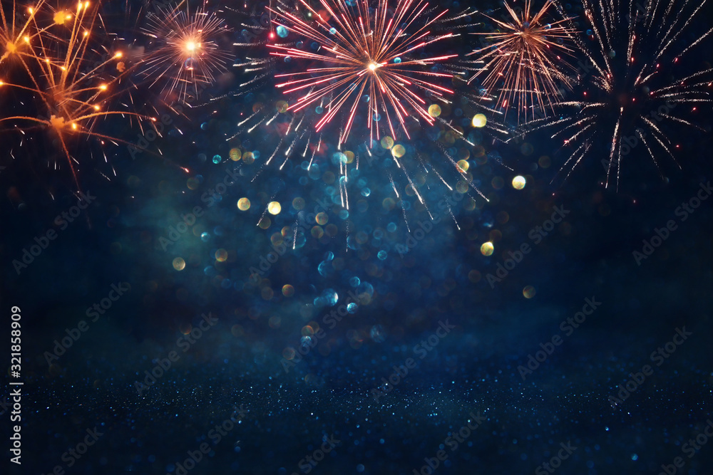 Fototapeta abstract gold, black and blue glitter background with fireworks. christmas eve, 4th of july holiday concept