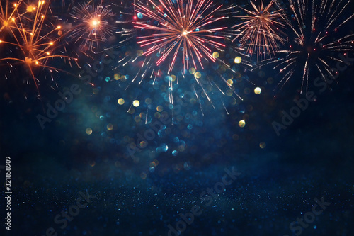 Billede på lærred abstract gold, black and blue glitter background with fireworks