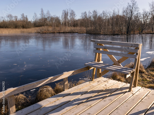 winter landscape with wooden pedestrian platform photo