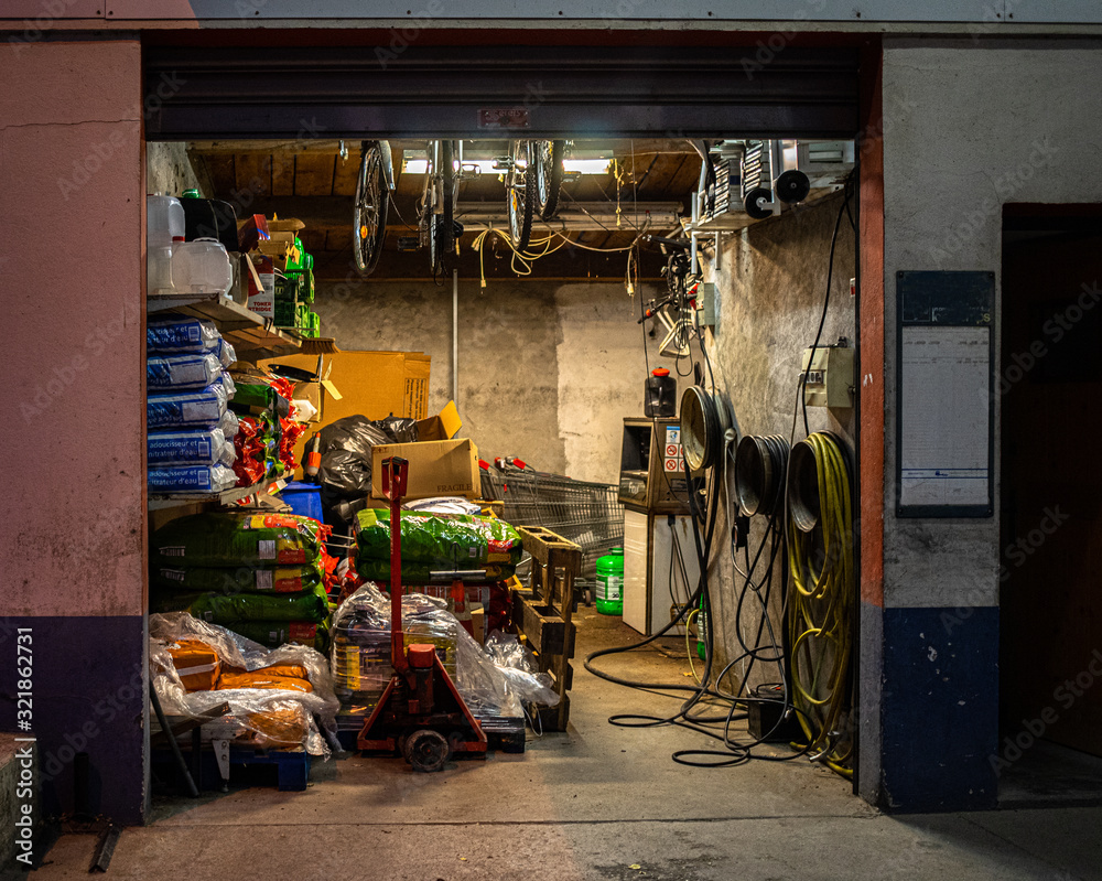 A view in the evening of a garage storing goods for a local store.