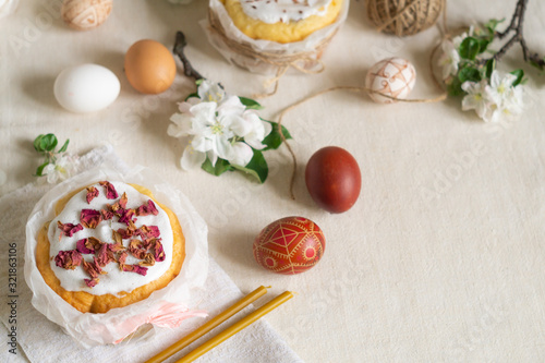 Traditional easter cakes, easter eggs and flowering apple tree branches