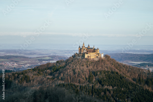 Elevated view of Hohenzollern Castle at sunrise, winter landscape, Baden Wuerttemberg, Germany