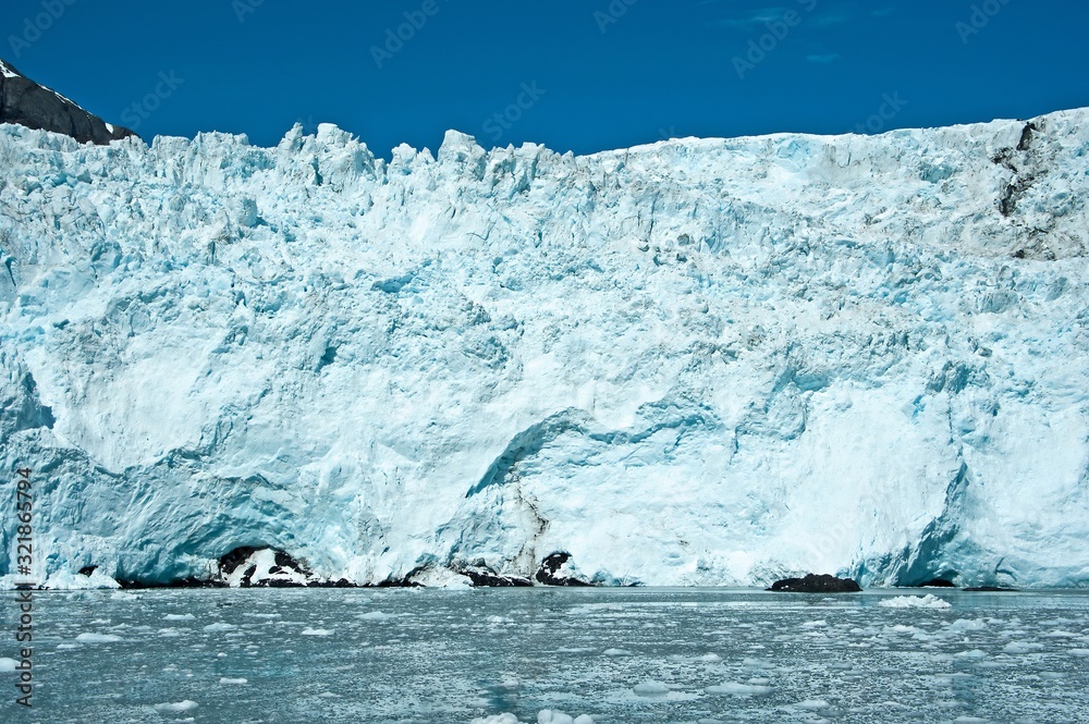 Melting glacier's of Alaska. A glacier is a slowly moving mass or river