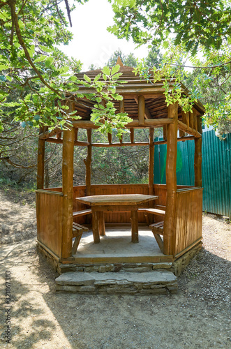 Obraz na płótnie Wooden arbor for rest in the botanical reserve Novyi Svit, Crimea w salonie