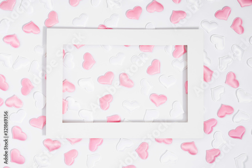 Valentine's Day background. Romantic composition with white and pink hearts on white background. Valentines Day heart. Flat lay, top view, copy space © Vtr_stock