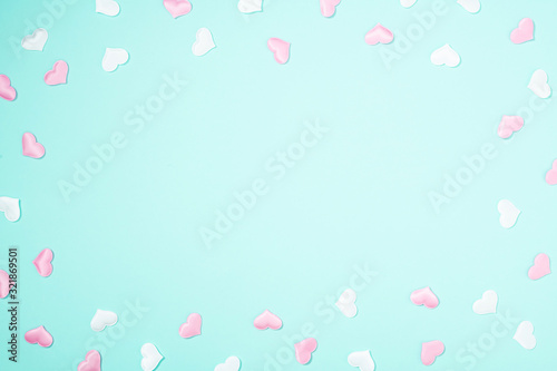 Valentine's Day background. Romantic composition with hearts on pastel blue background. Valentines Day heart. Flat lay, top view, copy space