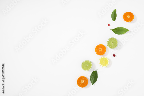 Citrus fruits pattern. Exotic fruits on white background. lemon  grapefruit  orange  lime  tangerine  fruit slices. Flat lay  top view  copy space