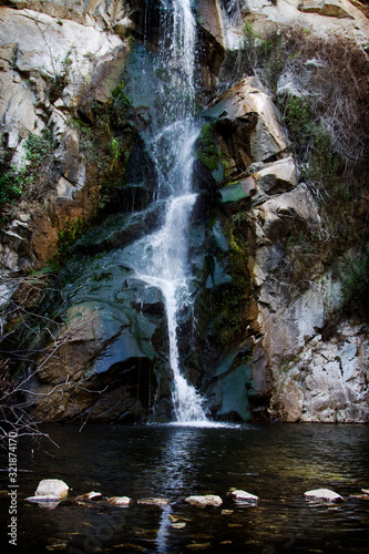 A tranquil waterfall in California with stepping stones