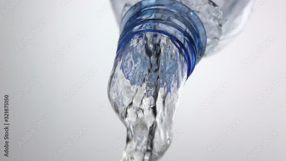 Slow motion : Pouring water from plastic bottle with white backgroud