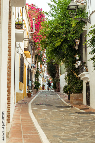 Marbella  Spain - August 26th  2018. Typical old town street with Spanish architecture in Marbella  Costa del Sol  Andalusia  Spain  Europe