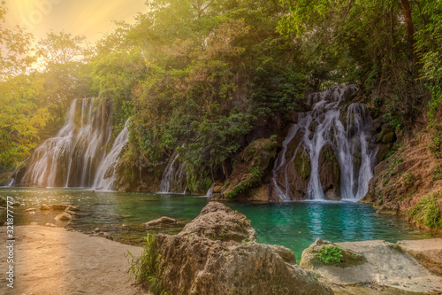Fototapeta Naklejka Na Ścianę i Meble -  sunset in the river  beautiful Waterfalls of Tamasopo san luis potosi mexico 