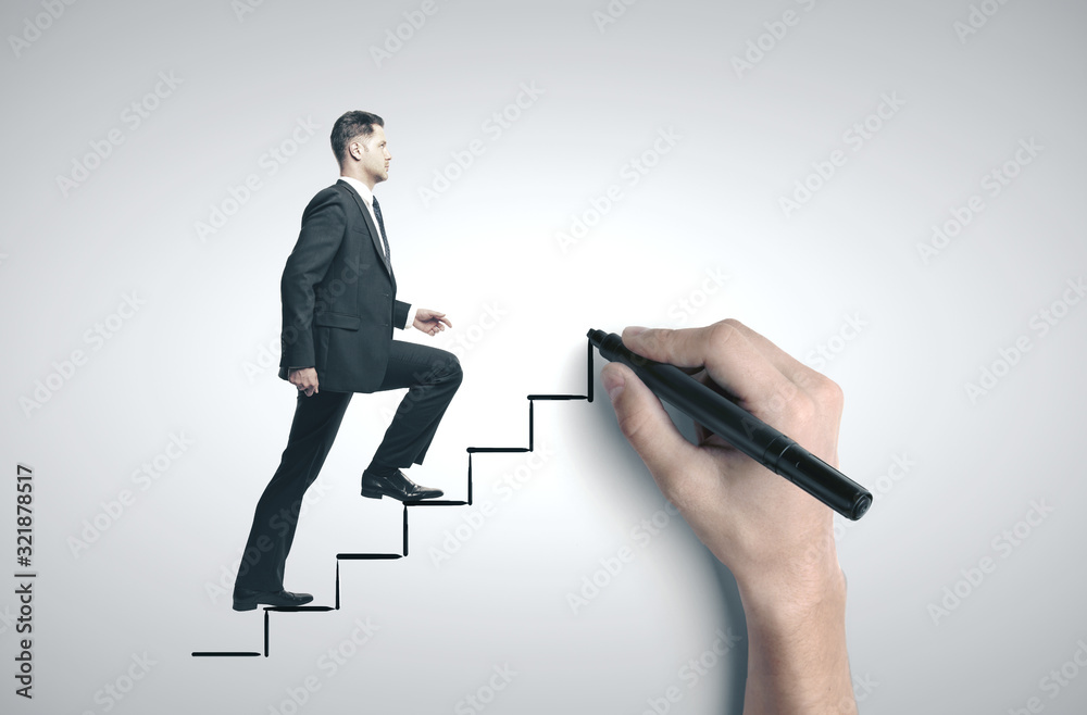 Fototapeta premium Businessman walking on drawing stairs.