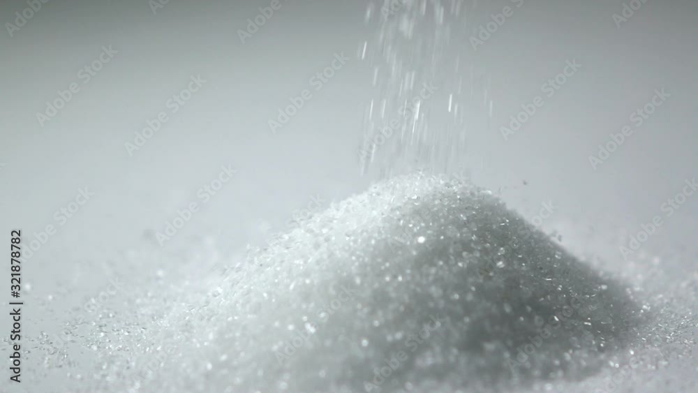 Slow motion shot : Close up White sugar Droping on white dish.