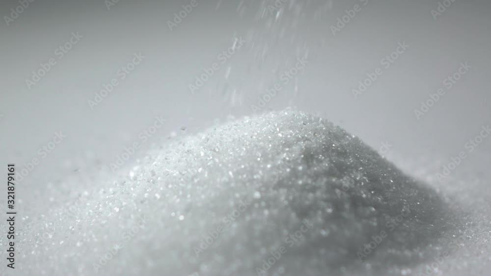 Slow motion shot : Close up White sugar Droping on white dish. Slow motion shot : Close up White sugar Droping on white dish.