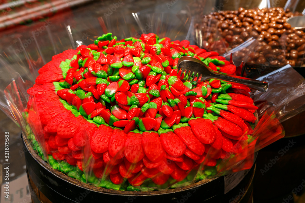 Fototapeta premium different candies, candies, sweets in a shop window in Venice. Textures and backgrounds with colorful bonbons