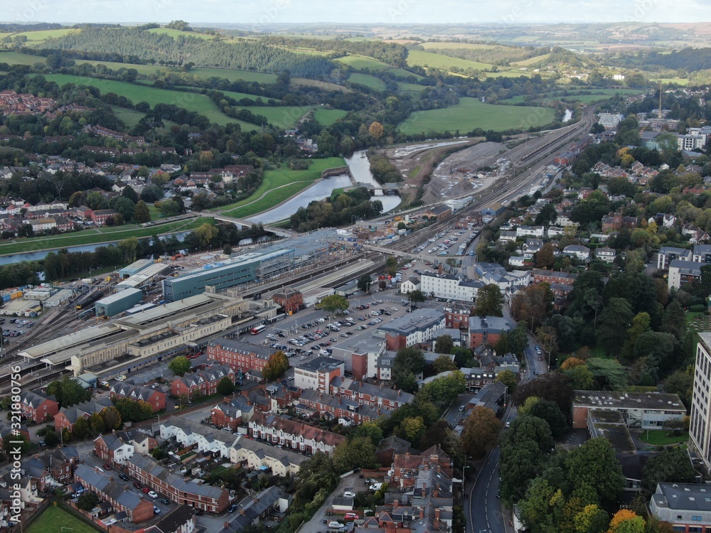 an aerial view of Exeter City centre , Devon , England, UK looking towards the canal and River Exe with Exeter ST.DAVIDS station