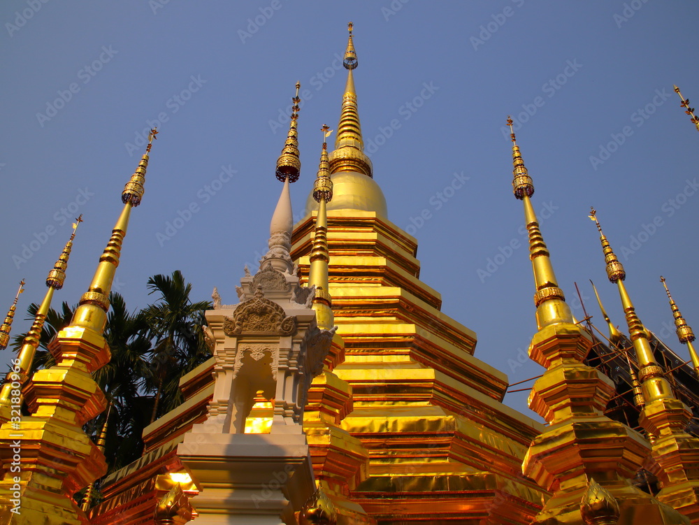 Fototapeta premium Temple in Chiangmai Thailand Beautifully decorated with wonderful colours statues of Buddha, Payanak, and Monks on walking street in the old city