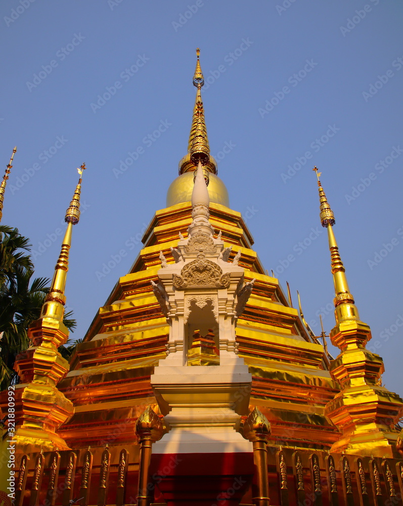 Fototapeta premium Temple in Chiangmai Thailand Beautifully decorated with wonderful colours statues of Buddha, Payanak, and Monks on walking street in the old city