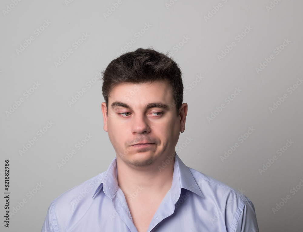 Distressed man brunette. Studio image of a handsome pensive man. Businessmen. Distressed man brunette. Studio image of a handsome pensive man. Businessmen.