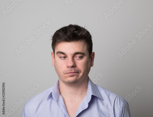 Distressed man brunette. Studio image of a handsome pensive man. Businessmen. © Eugene