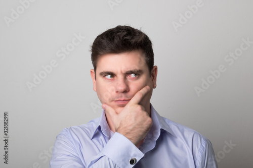 Distressed man brunette. Studio image of a handsome pensive man. Businessmen.