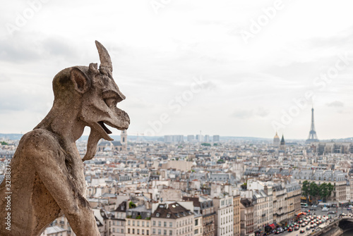 Detail of a gargoyle on the Notre Dame cathedral in Paris, France.