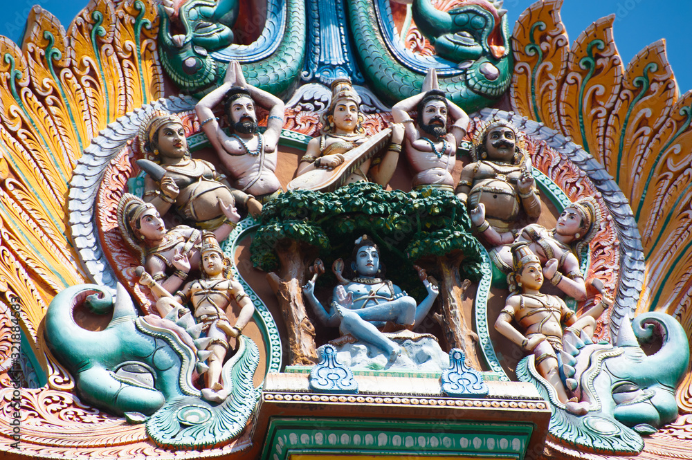 Great Indian architecture and religious art. Gods pantheon at Temple Gopuram (tower) facade Ancient colorful statues of Mahabharata Heroes South India