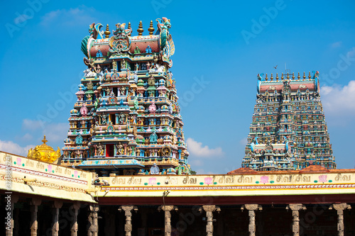 Great Indian architecture and religious art. Gods pantheon at Temple Gopuram (tower) facade Ancient colorful statues of Mahabharata Heroes South India photo