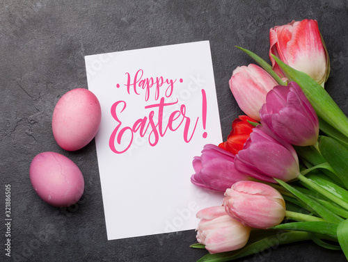 Easter greeting card with eggs and tulips