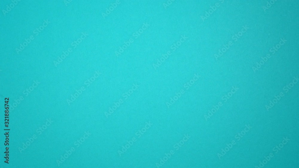 Closeup top view of beautiful female hand making gestures on blue background as if scrolling pages up and down in browser of digital mobile device with touch screen.