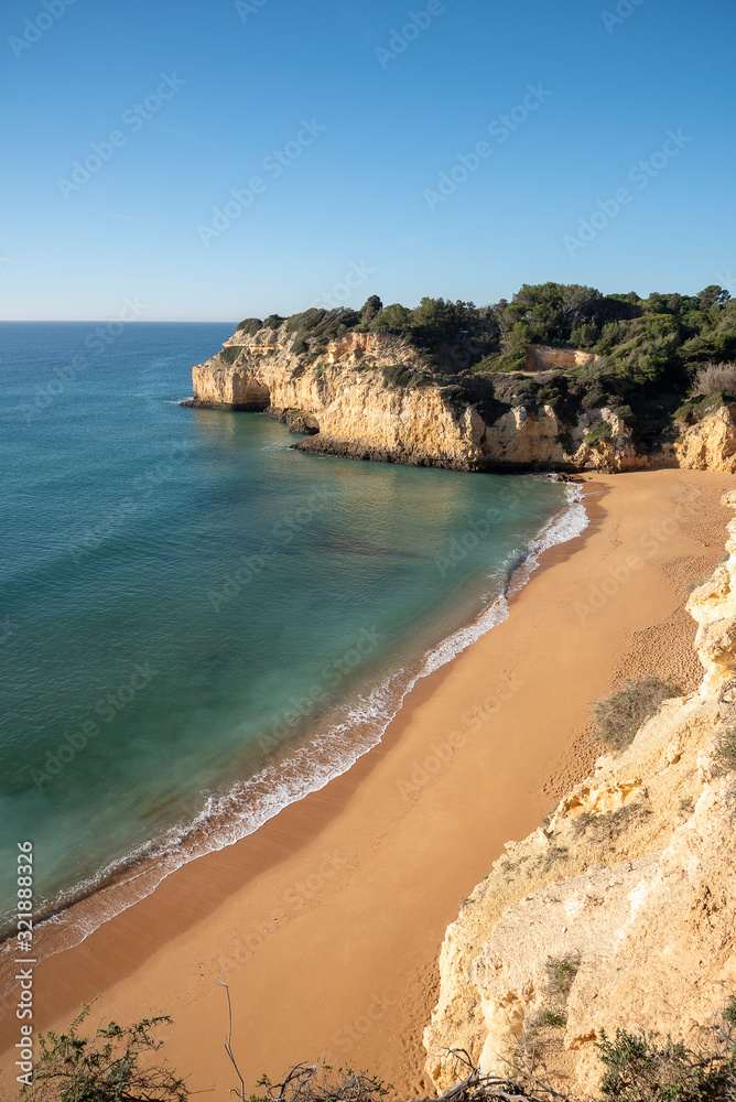 high cliffs and high tide on the shore of the Atlantic Ocean. Portugal. Algarve.