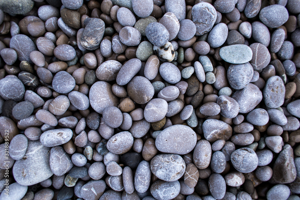 Small round pebbles on the seashore. Small round pebbles on the seashore.