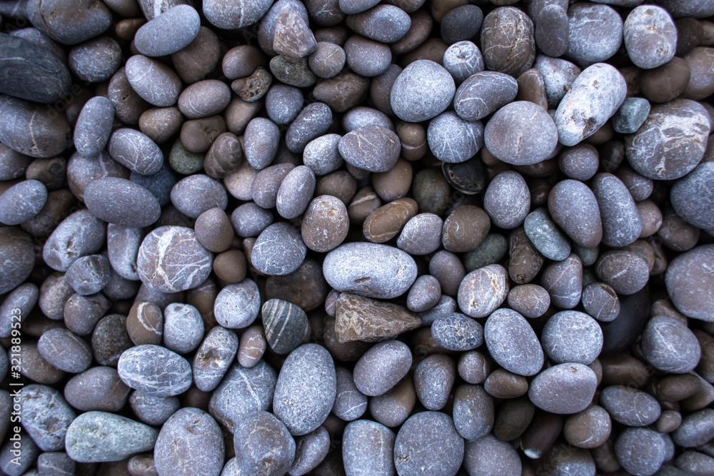 Small round pebbles on the seashore. Small round pebbles on the seashore.