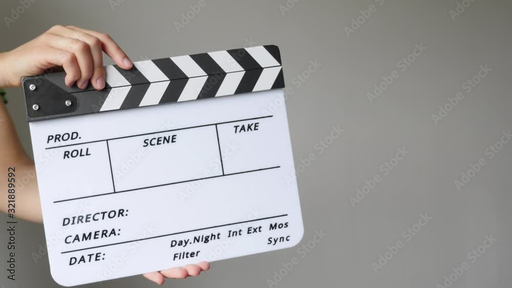 Footage of a person using a clapper board isolated...