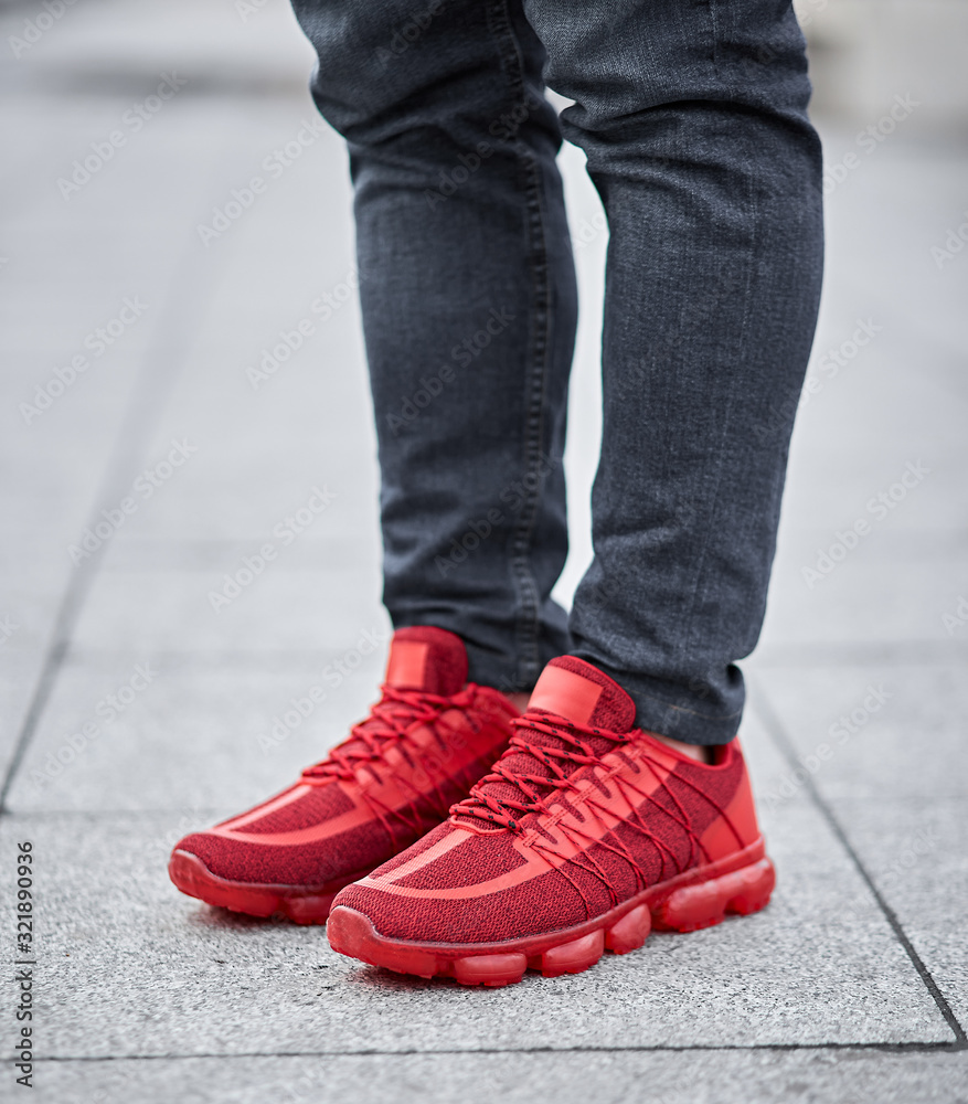 red sneakers shoes on the floor red sneakers shoes on the floor