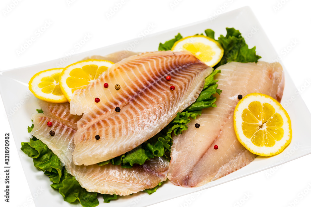 Whitefish Tilapia Fish Raw Fillet Isolated on White Background. Selective focus. Whitefish Tilapia Fish Raw Fillet Isolated on White Background. Selective focus.