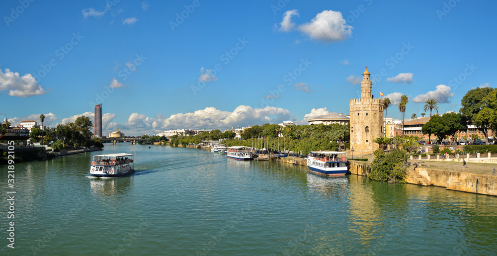 Panorama of Seville, the Golden Tower and the embankment of the river.